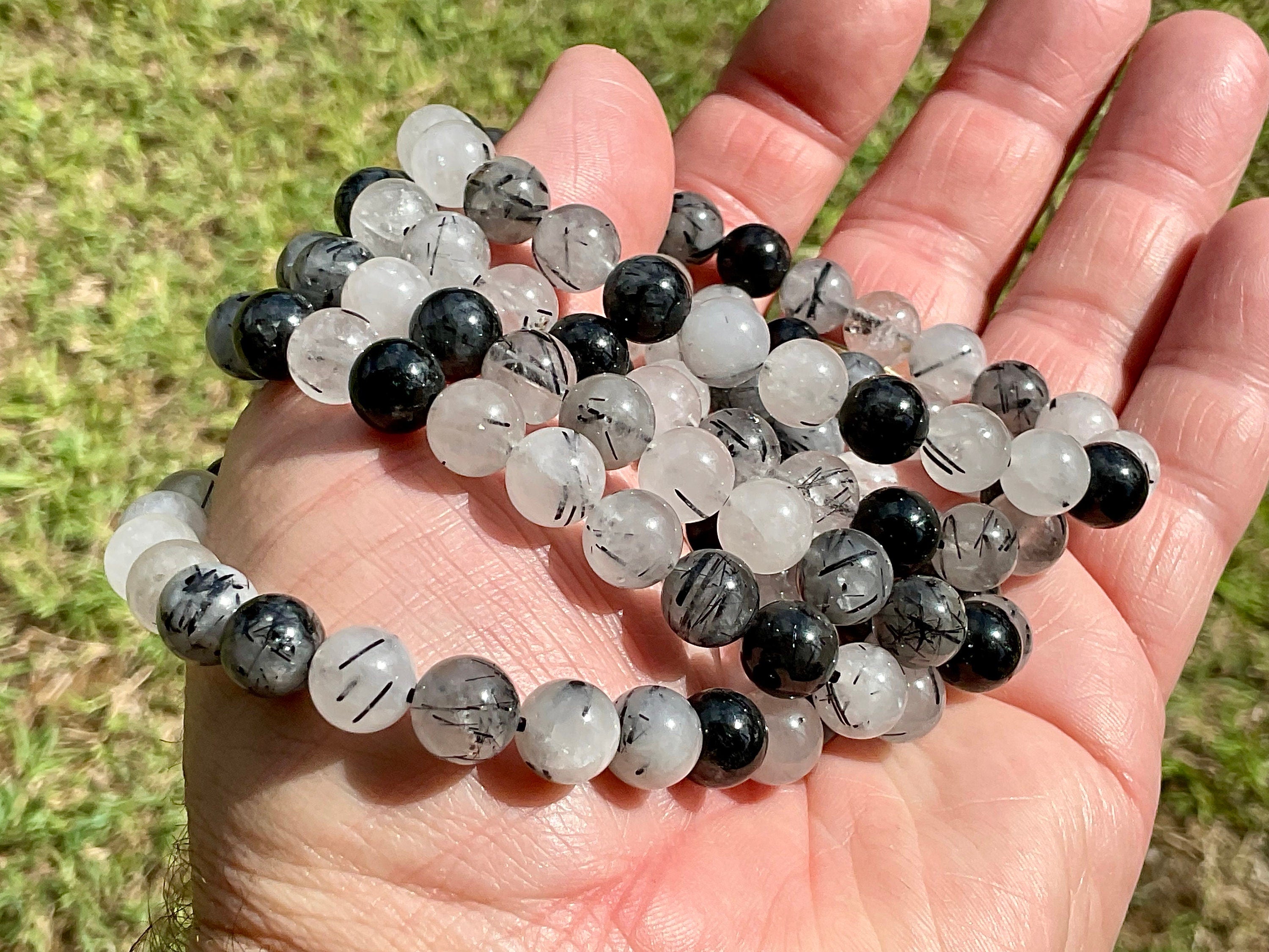 A Grade Tourmaline in Clear Quartz 8mm Bead Bracelet