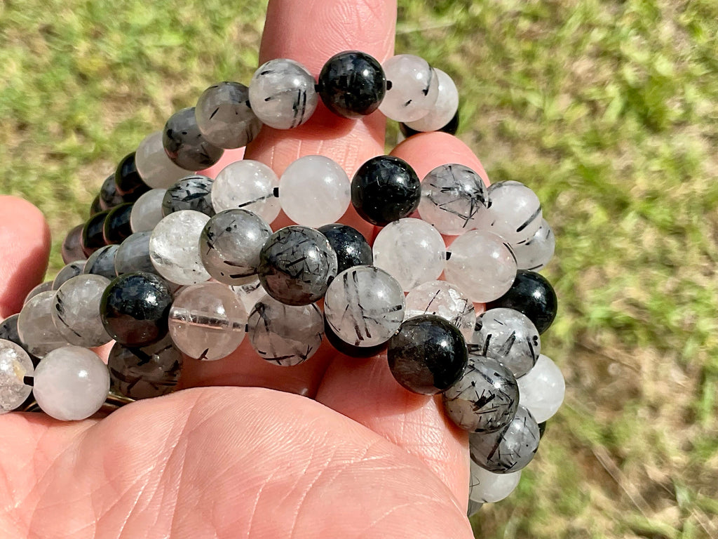 A Grade Tourmaline in Clear Quartz 8mm Bead Bracelet
