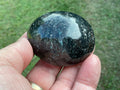 104g Arfvedsonite with Eudialyte Palmstone 6A