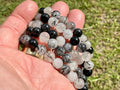 A Grade Tourmaline in Clear Quartz 8mm Bead Bracelet