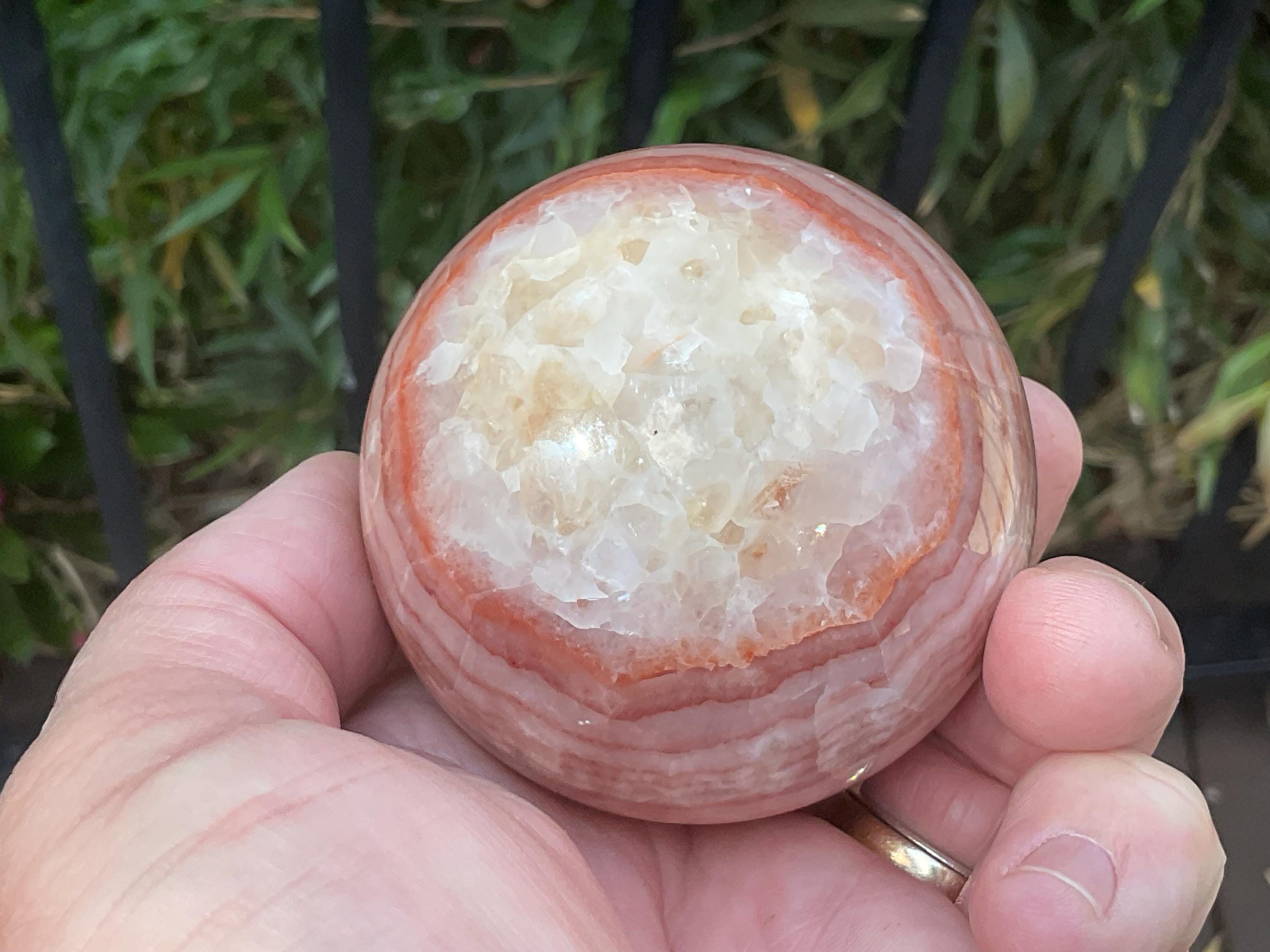 369g (5.9cm diameter) Red Banded Calcite Sphere A