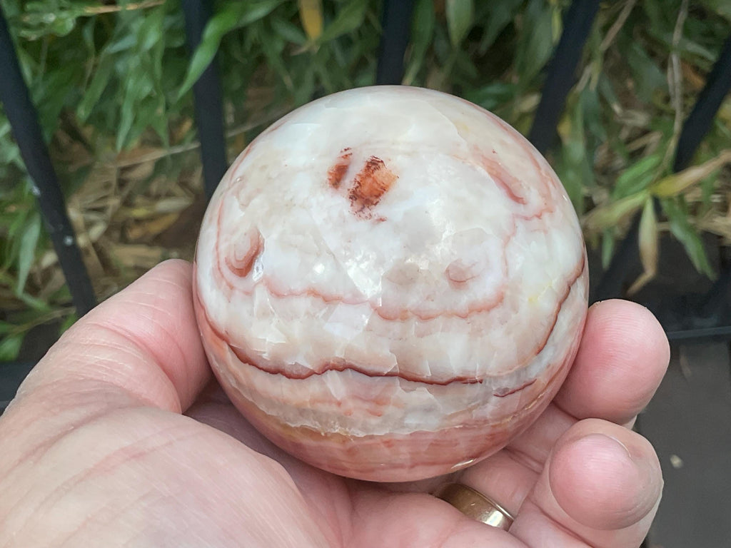 390g (6cm diameter) Red Banded Calcite Sphere B