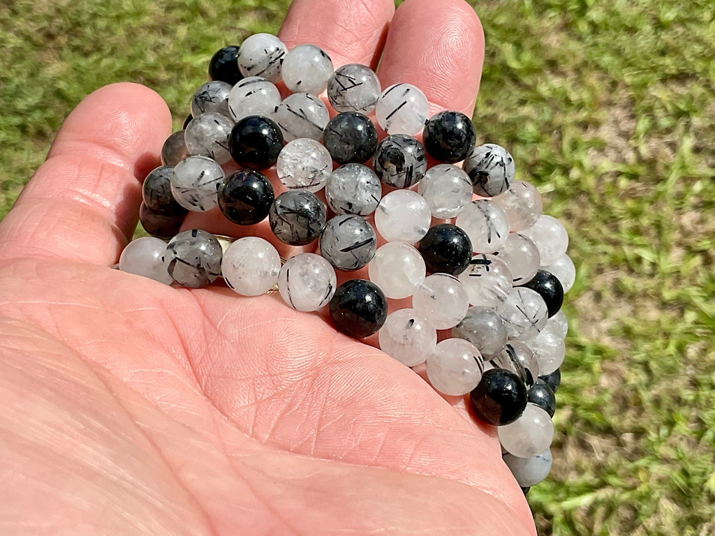 A Grade Tourmaline in Clear Quartz 8mm Bead Bracelet