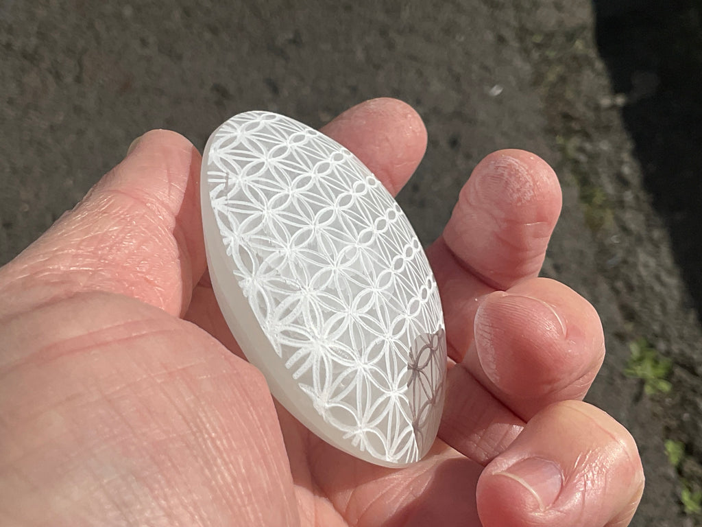 100g Flower of Life Etched Selenite Palmstone 2A