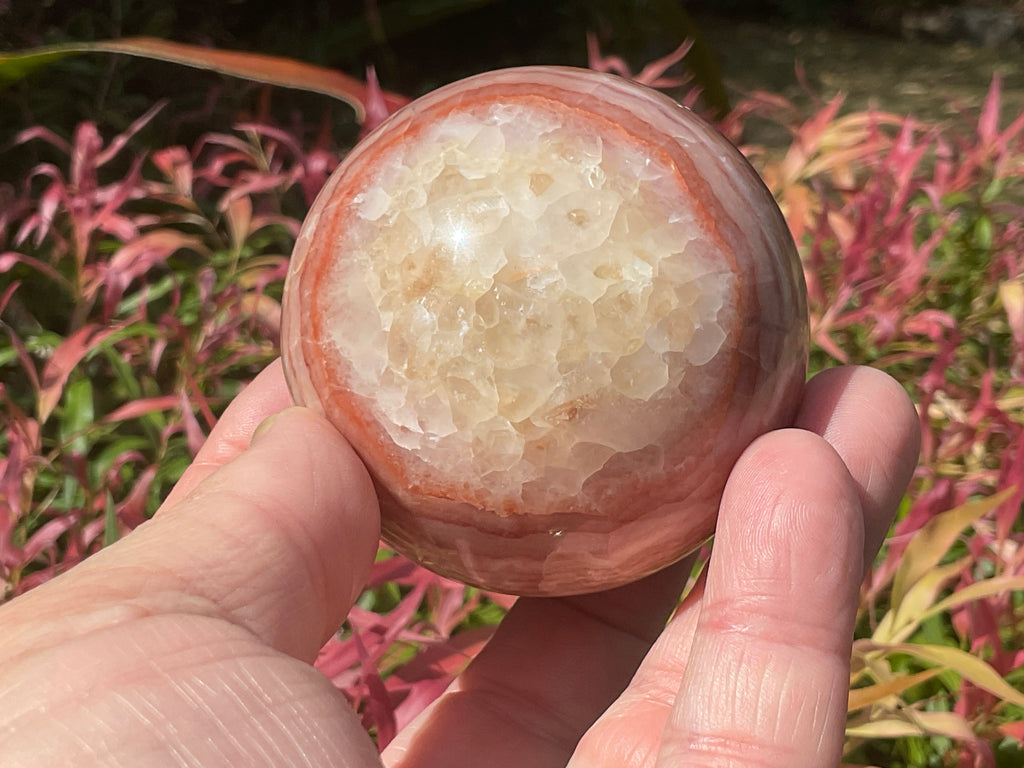 369g (5.9cm diameter) Red Banded Calcite Sphere A