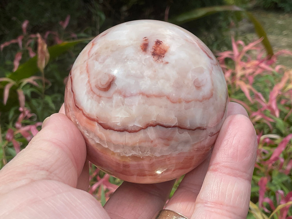 390g (6cm diameter) Red Banded Calcite Sphere B