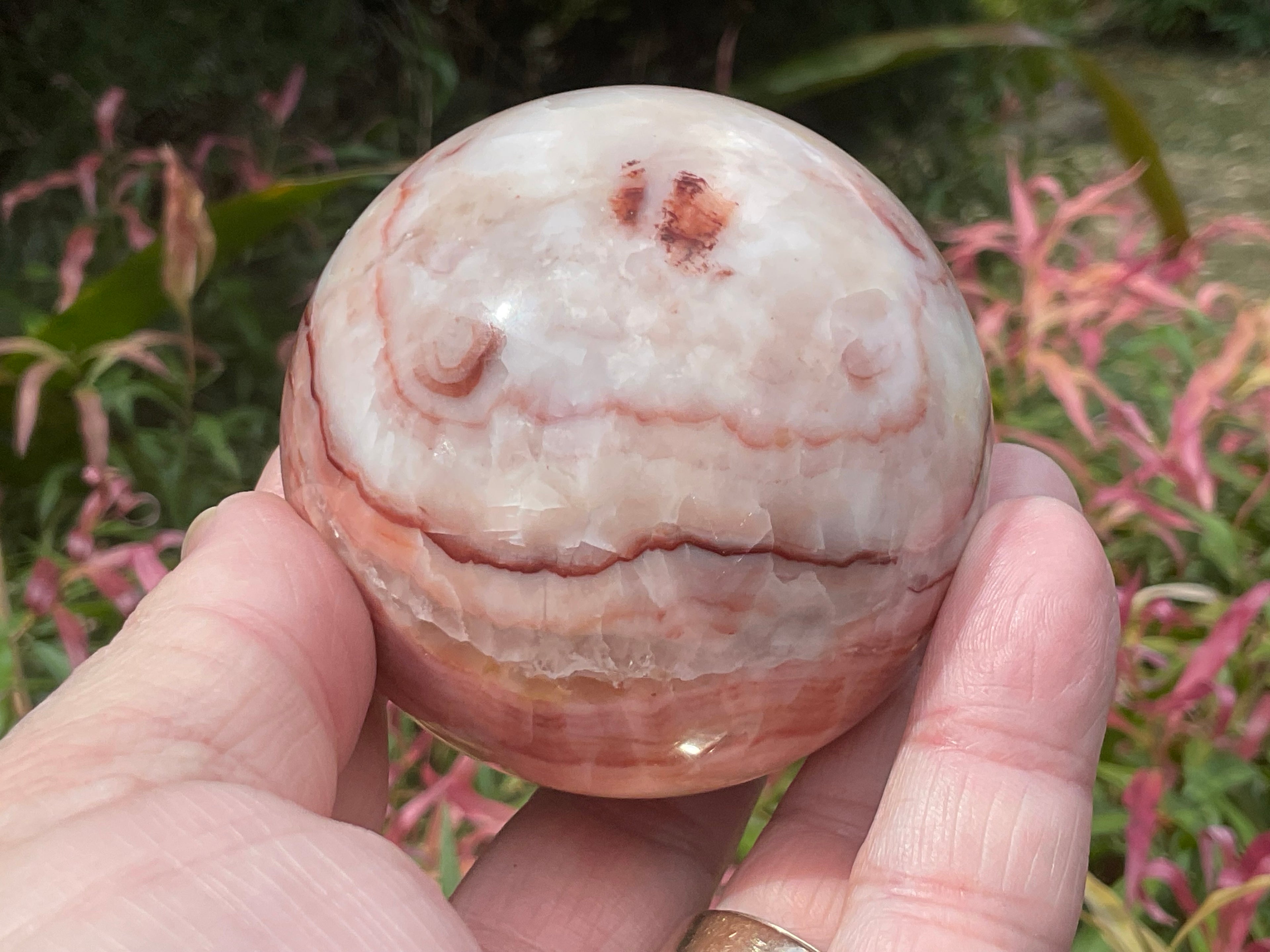 390g (6cm diameter) Red Banded Calcite Sphere B