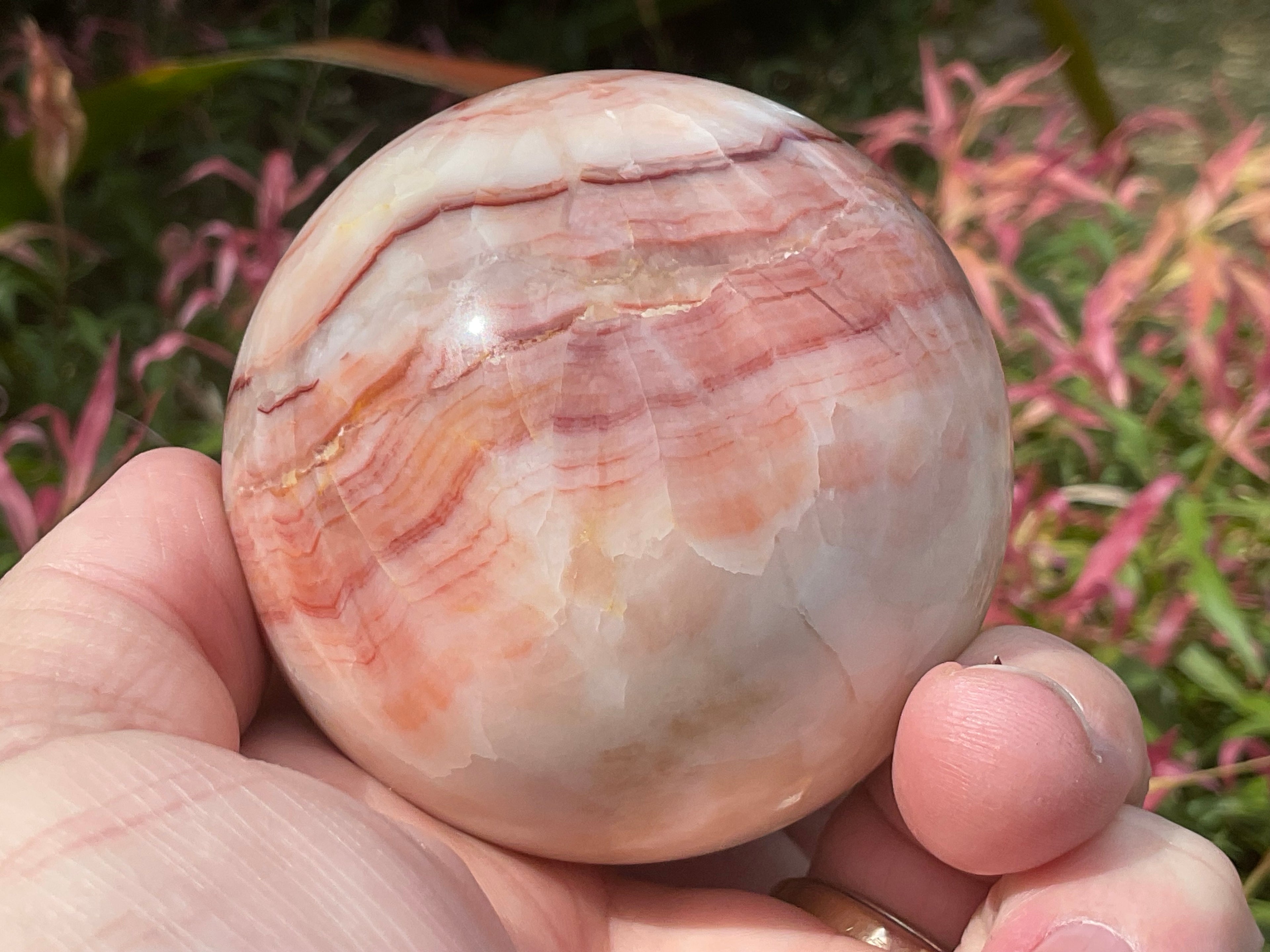 390g (6cm diameter) Red Banded Calcite Sphere B