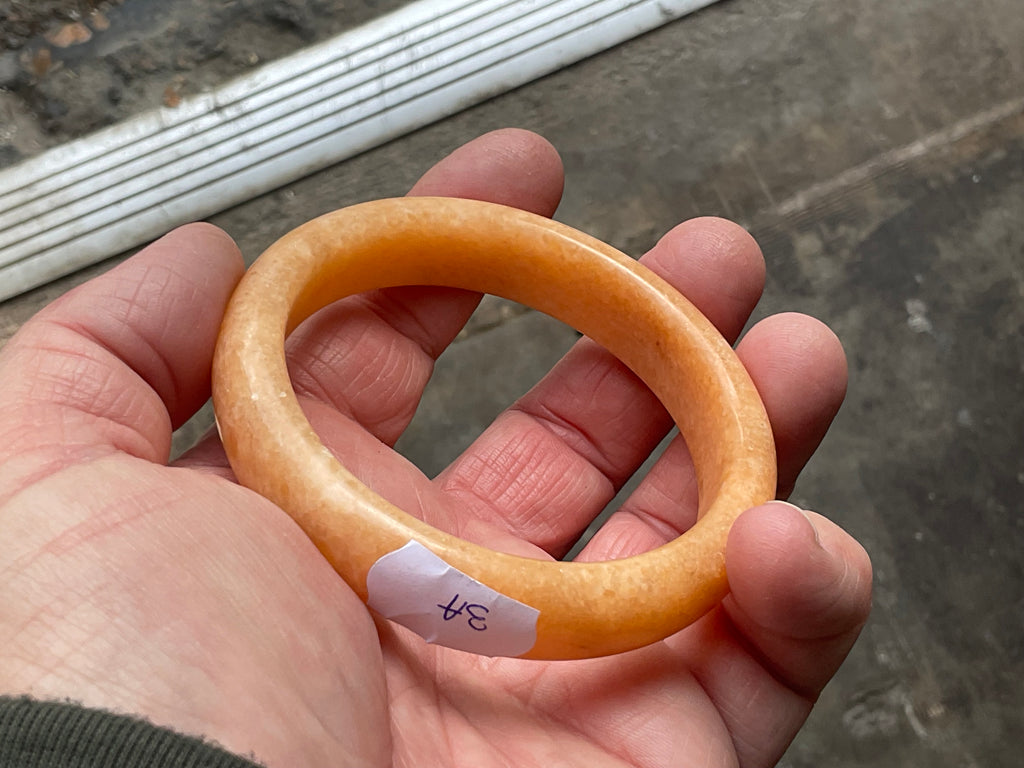 60g Orange Calcite Solid Bangle 3A