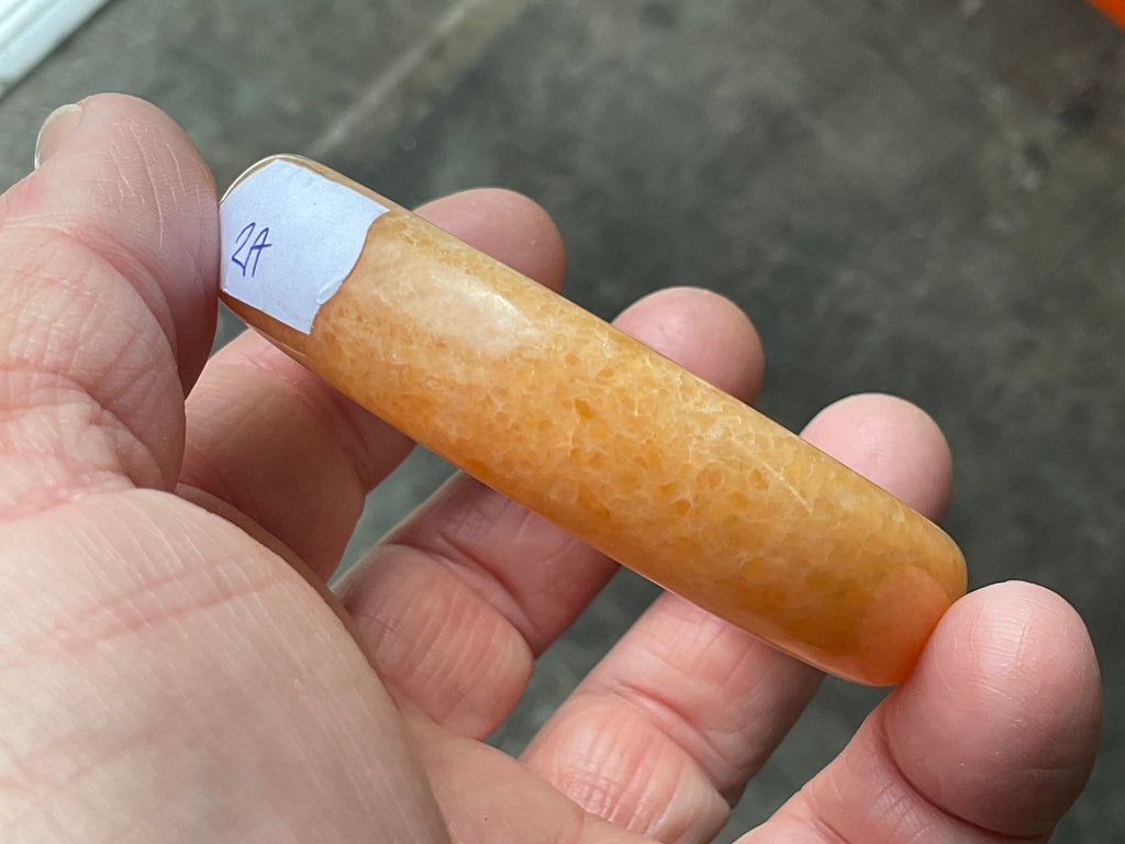 48g Orange Calcite Solid Bangle 2A