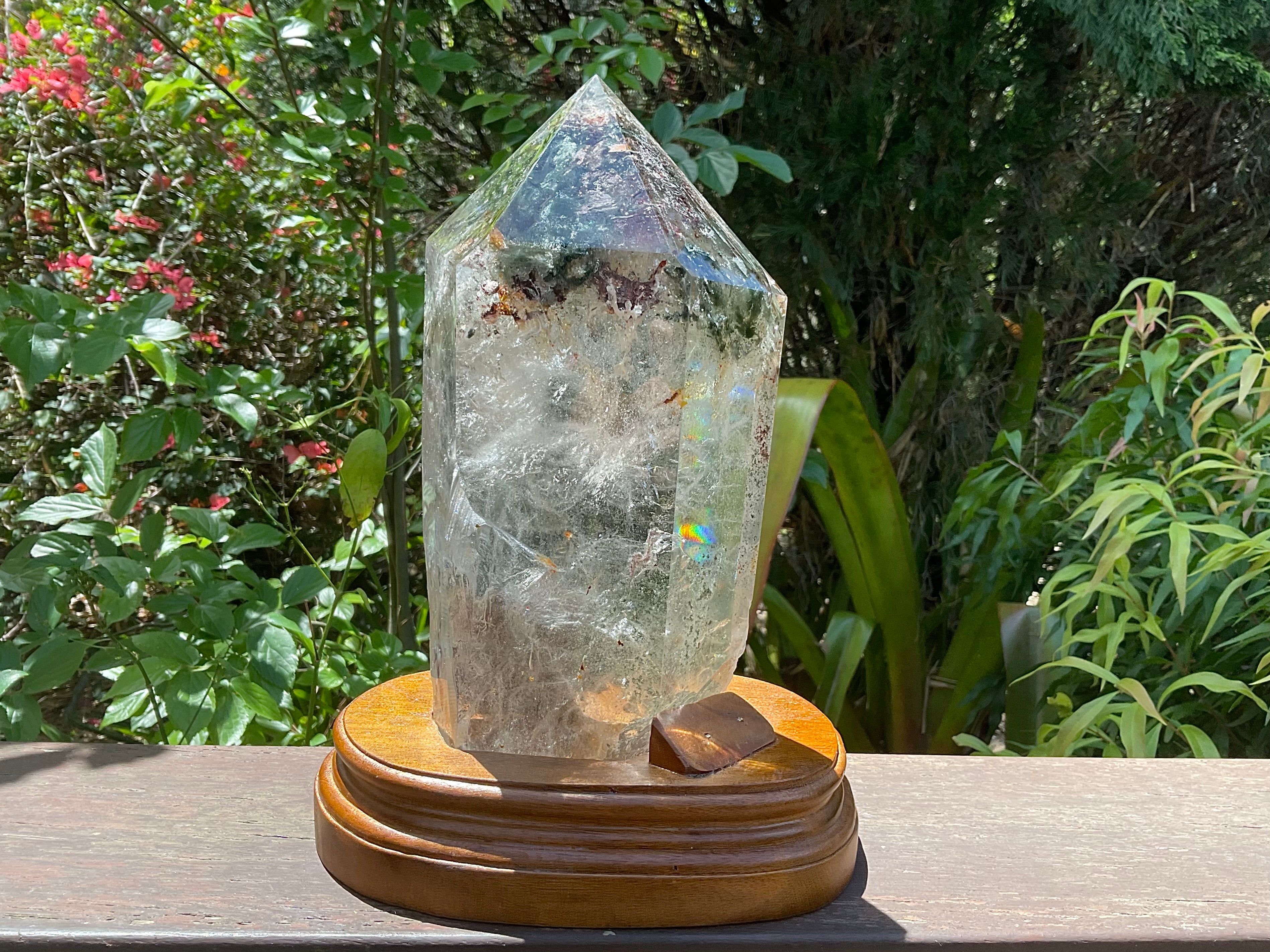 2788g XXL Garden Quartz Polished Point with custom wooden stand.