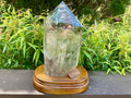 2788g XXL Garden Quartz Polished Point with custom wooden stand.