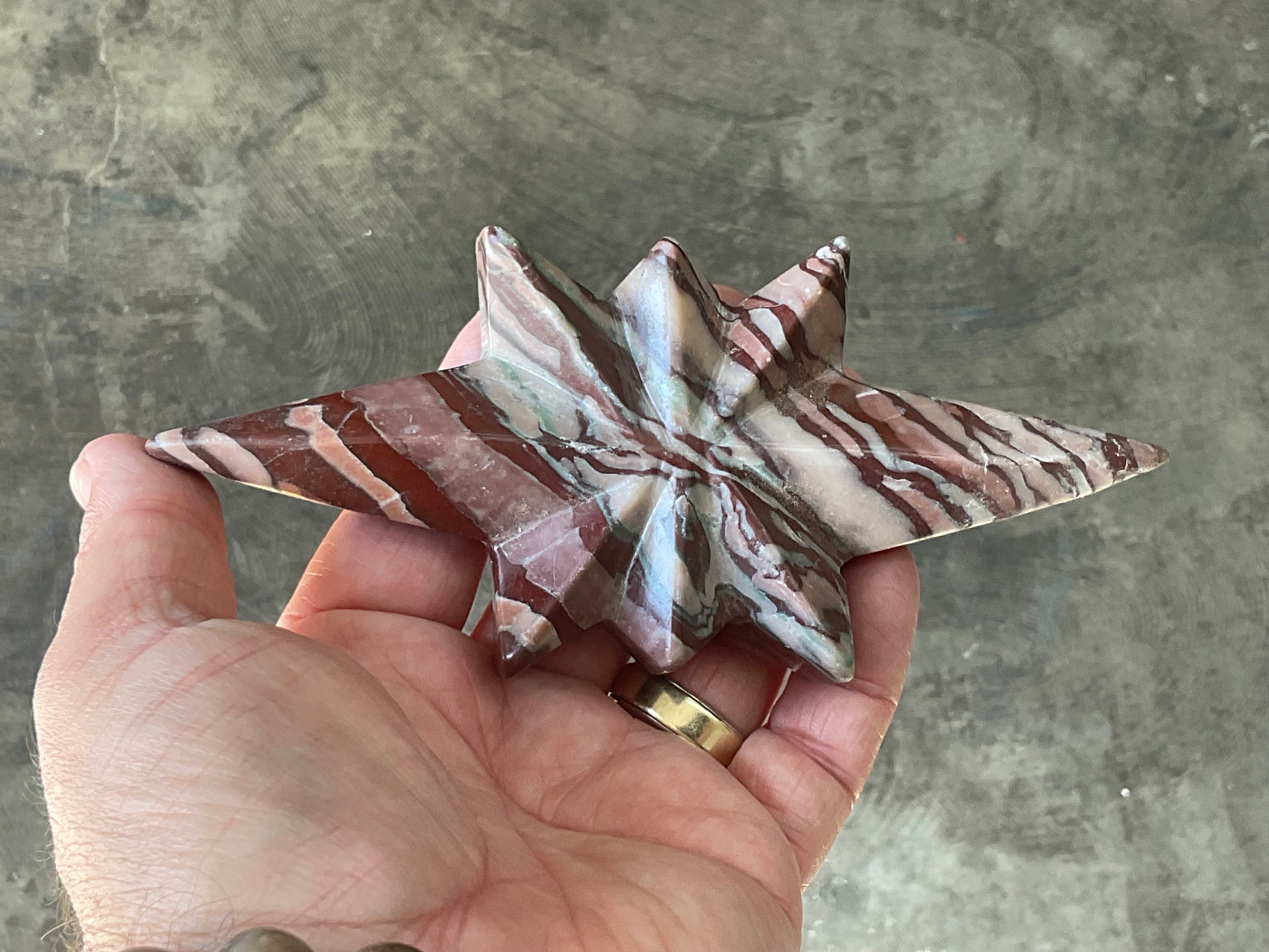 194g Striped Jasper Polaris Carving with Custom Wooden Stand 1