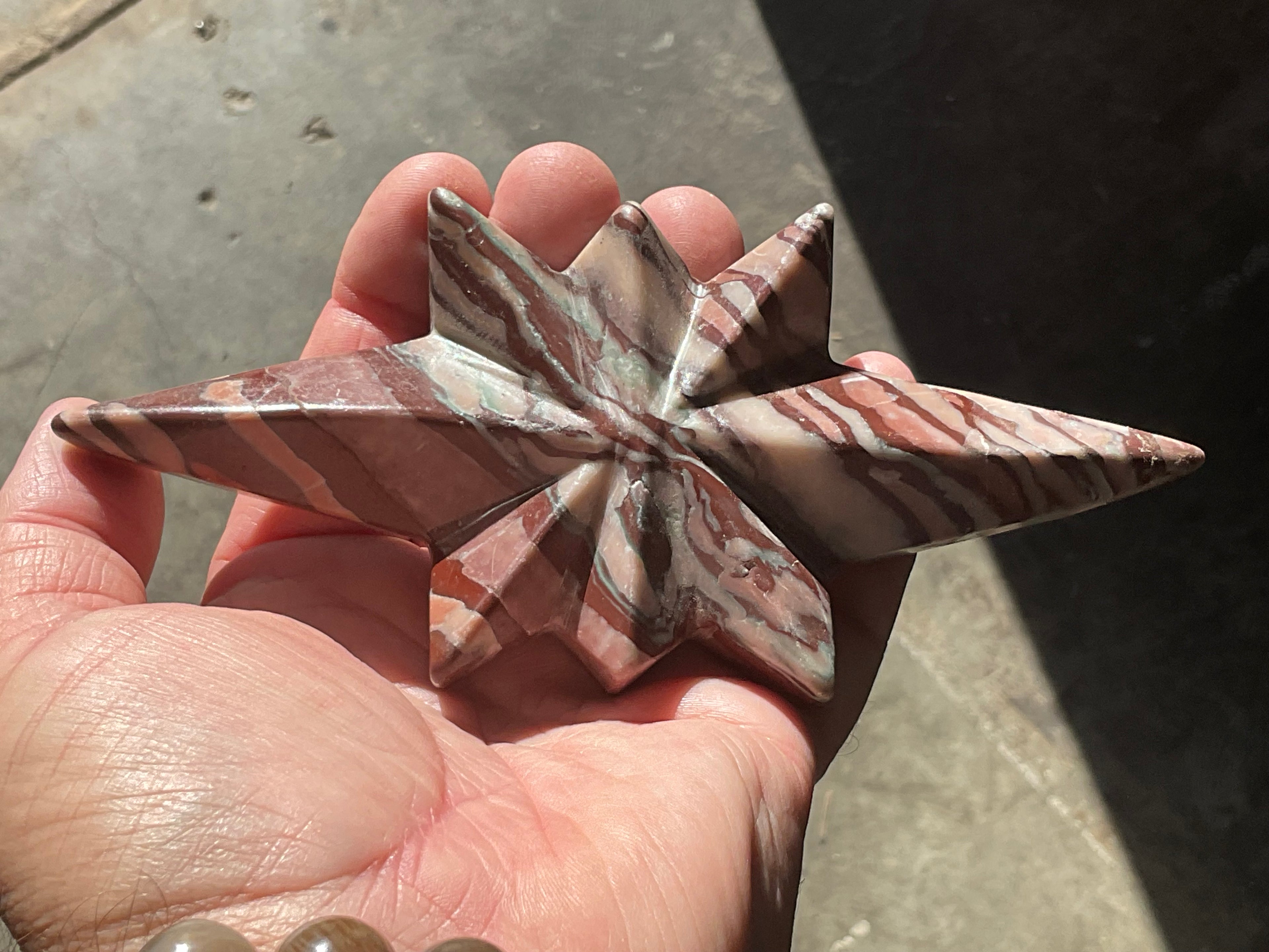 194g Striped Jasper Polaris Carving with Custom Wooden Stand 1