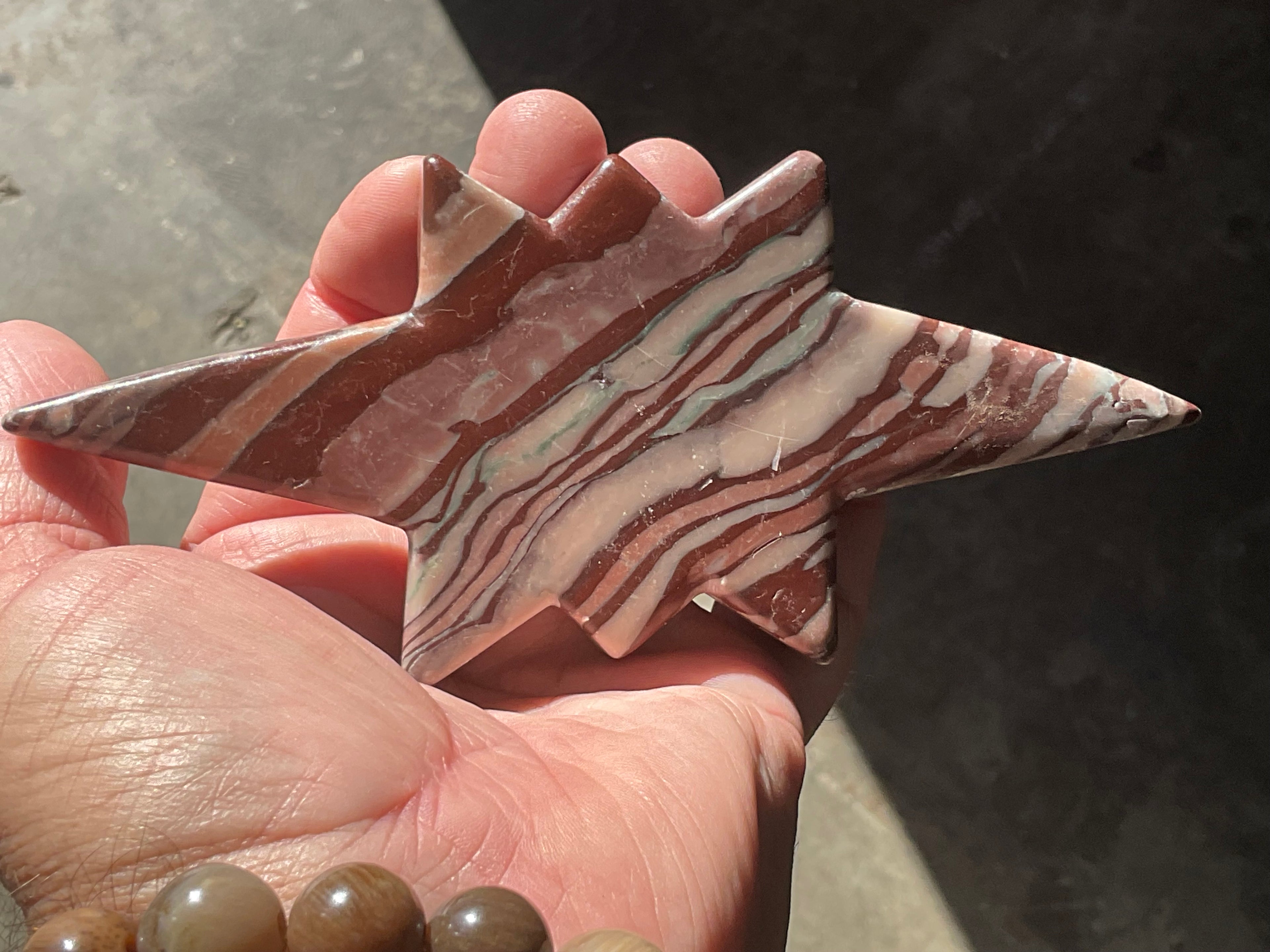 194g Striped Jasper Polaris Carving with Custom Wooden Stand 1