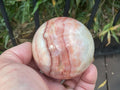 390g (6cm diameter) Red Banded Calcite Sphere B