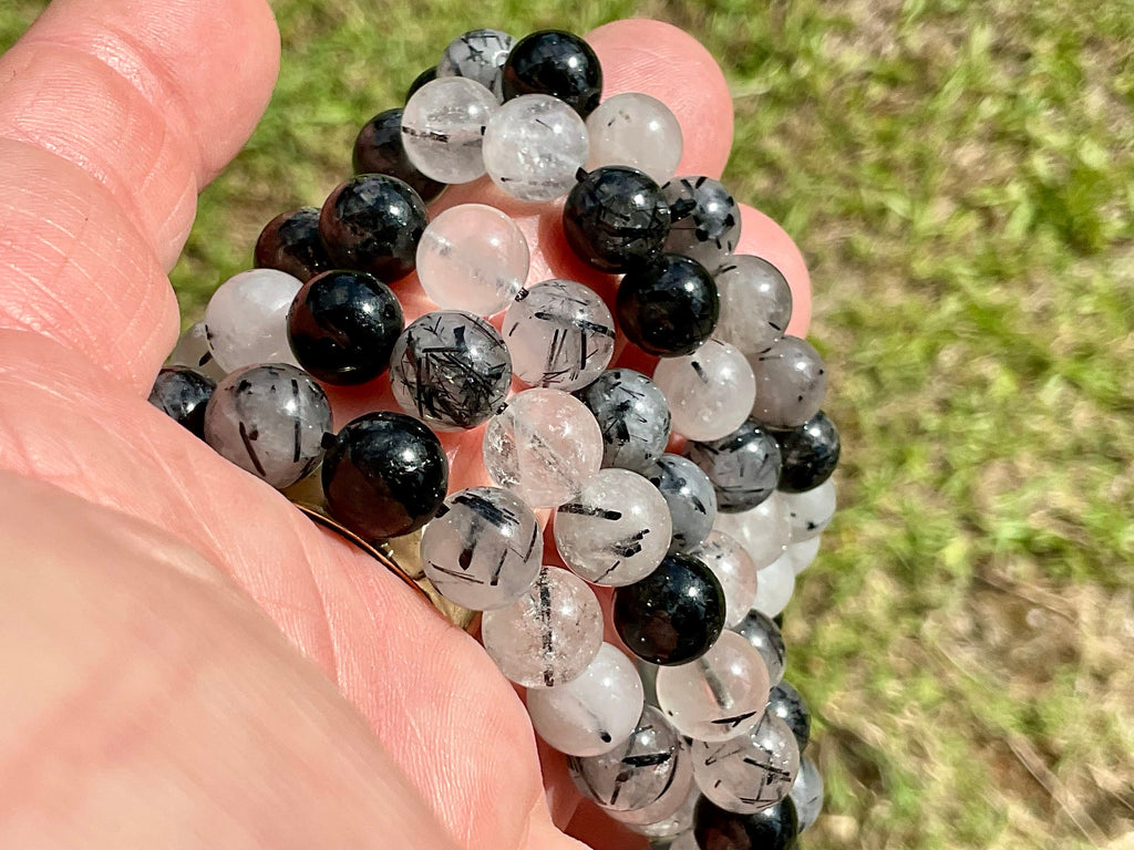 A Grade Tourmaline in Clear Quartz 8mm Bead Bracelet