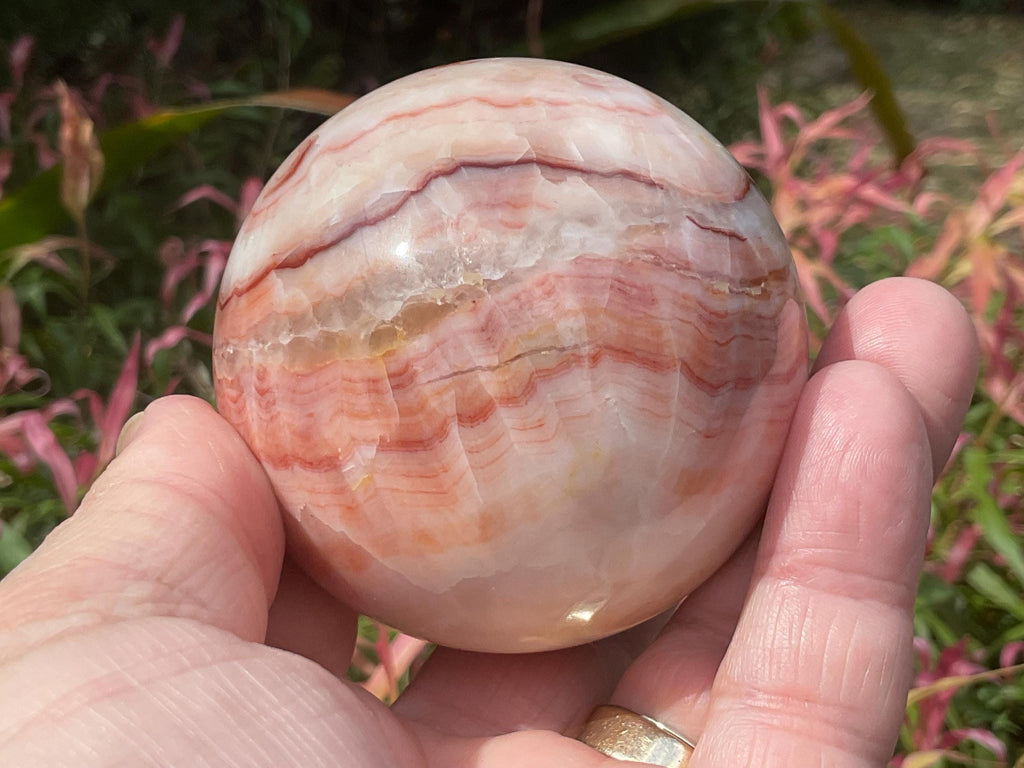 390g (6cm diameter) Red Banded Calcite Sphere B