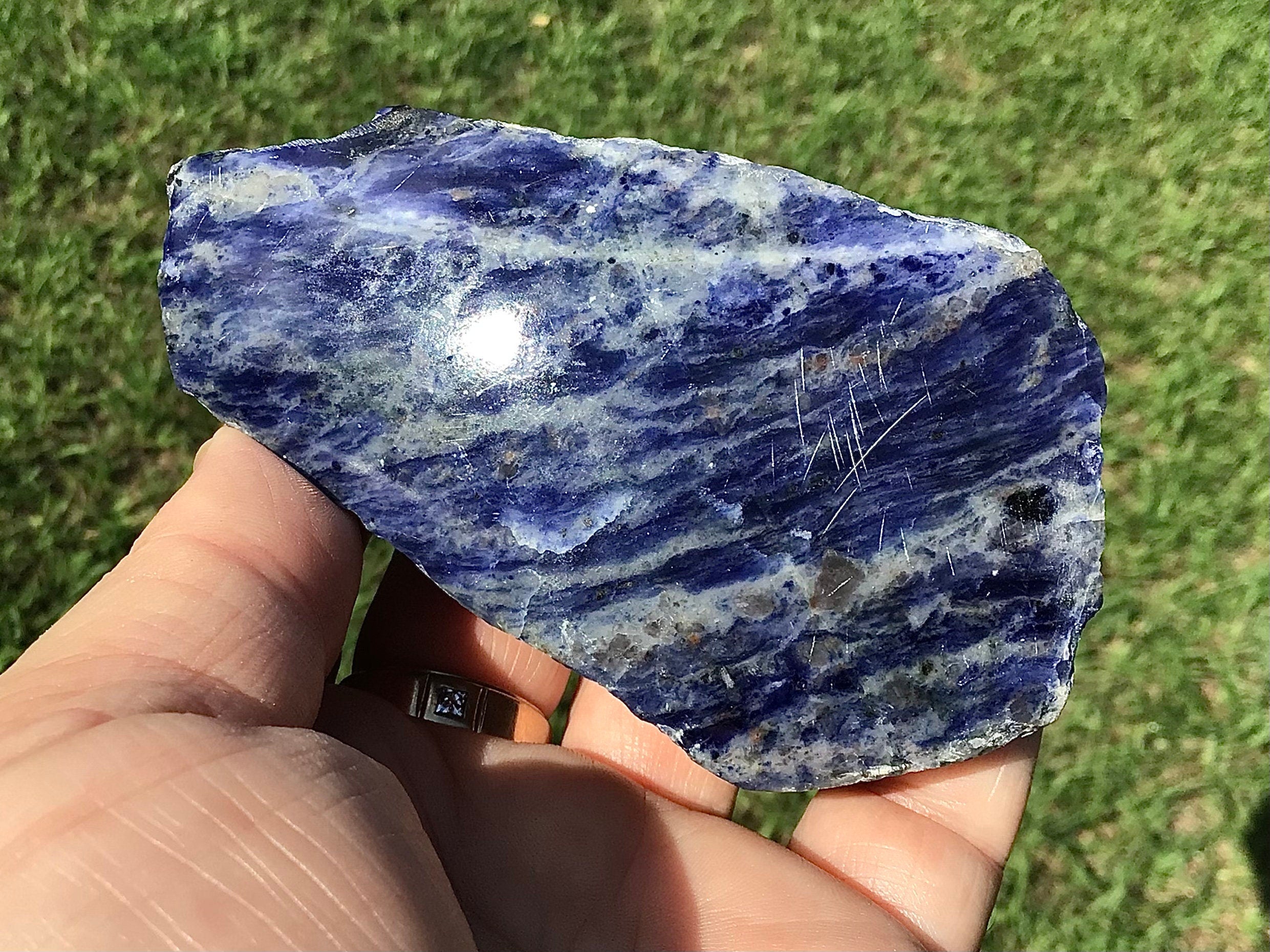 195g Sodalite with Graphite One Side Polished 1C