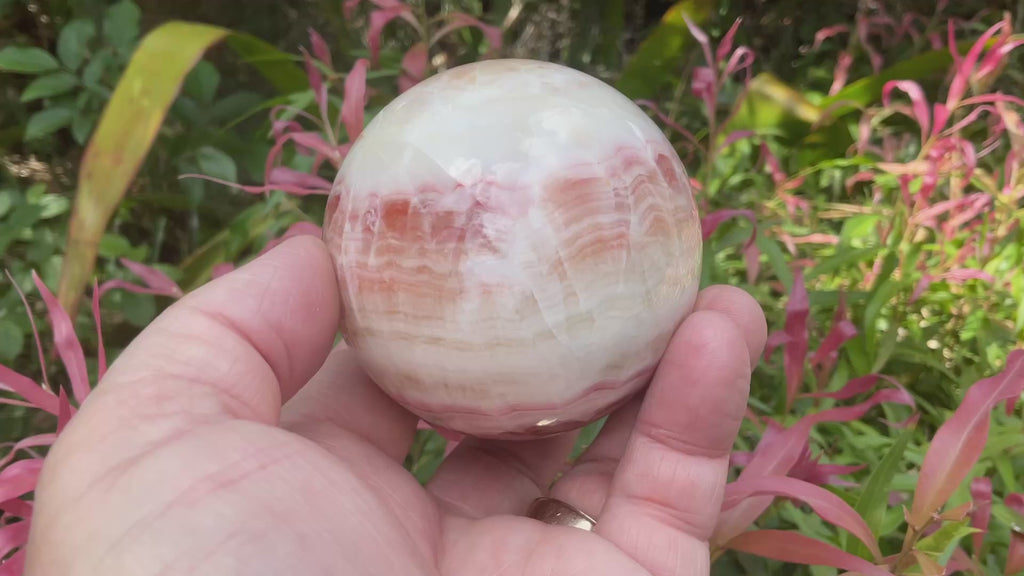 452g (6.3cm diameter) Red Banded Calcite Sphere C